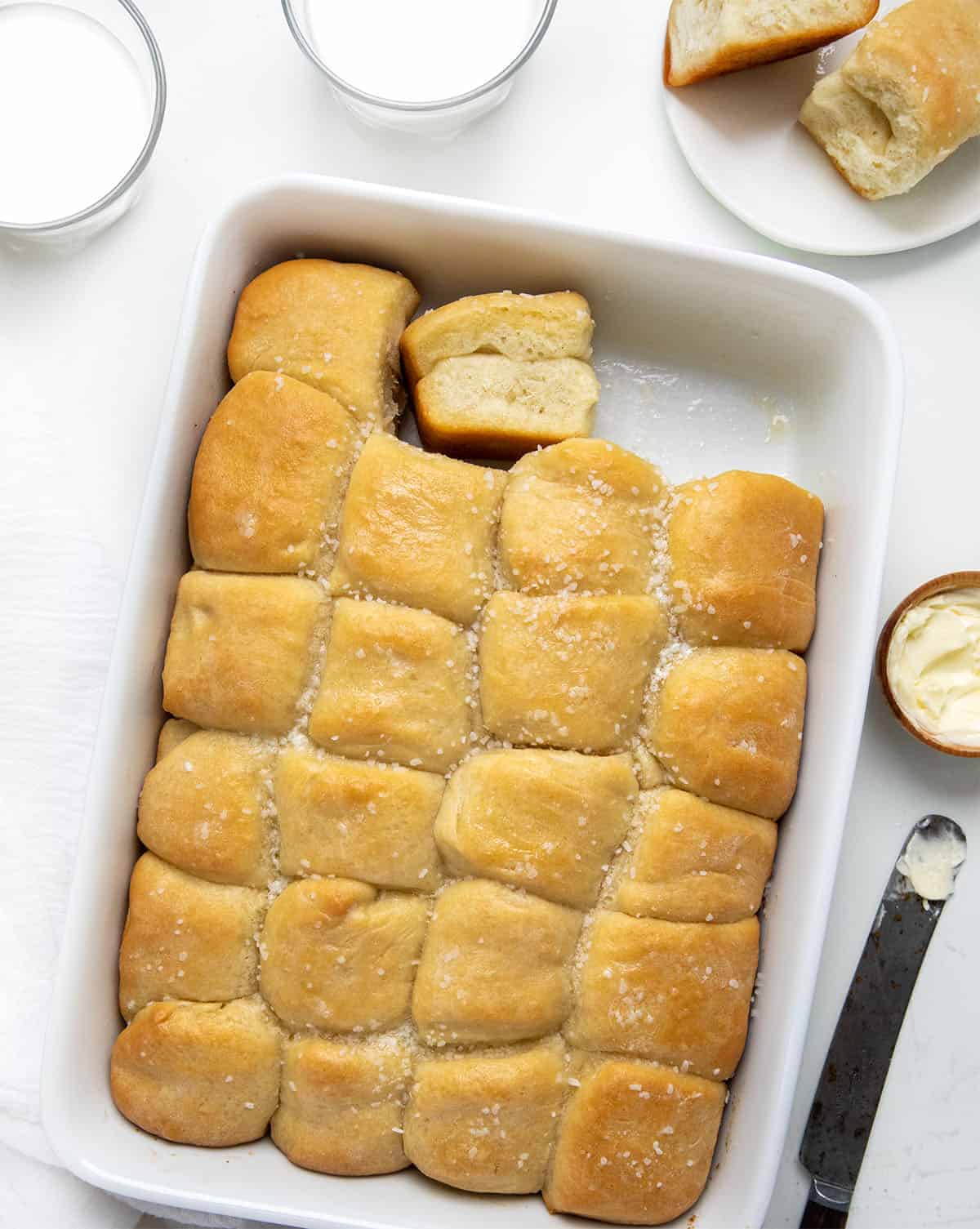 overhead of parker house dinner rolls with one missing