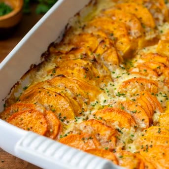 Close up of Scalloped Sweet Potatoes in pan.