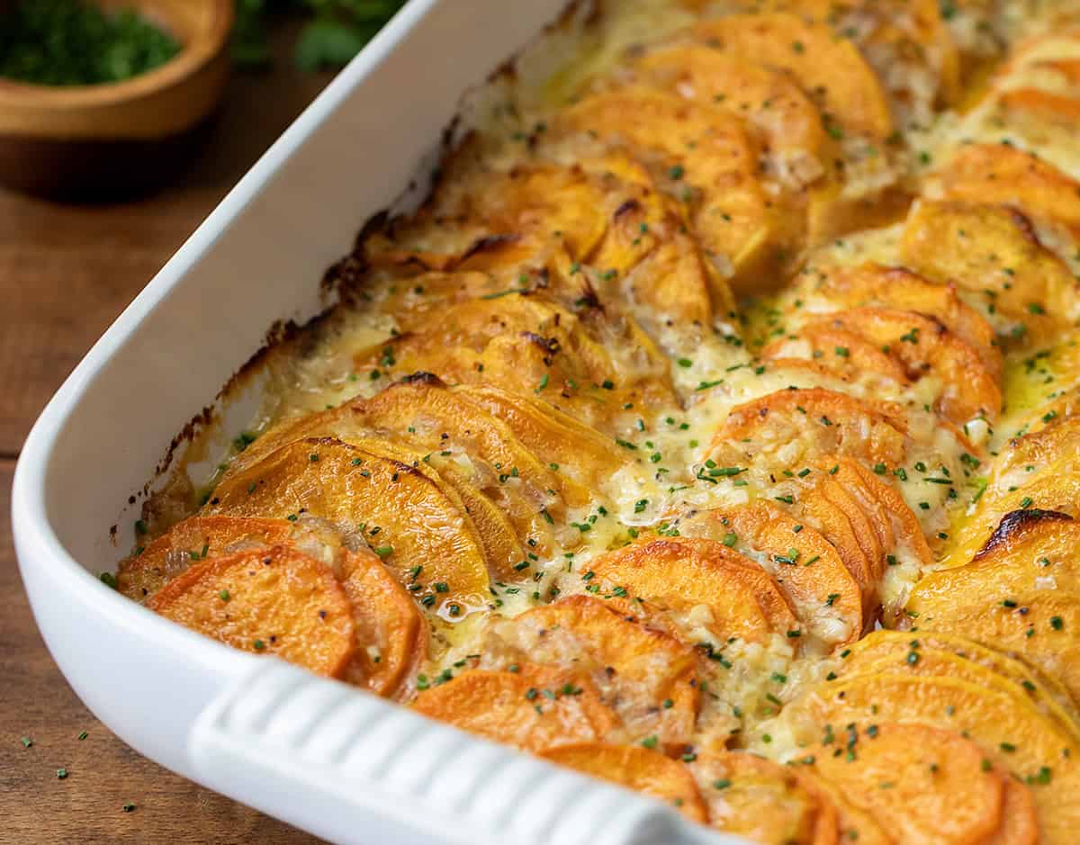 Close up of Scalloped Sweet Potatoes in pan.