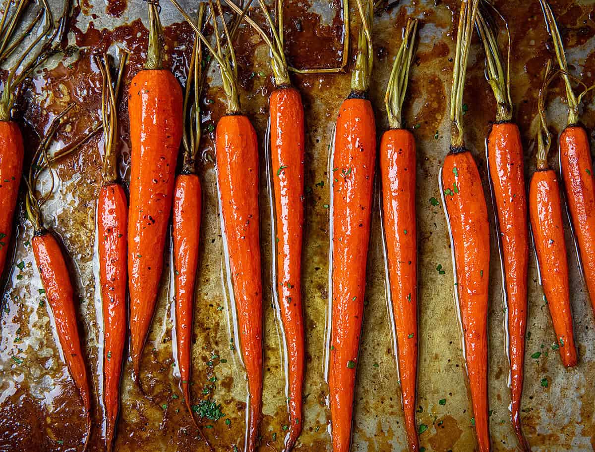 Close up of Bourbon Glazed Carrots on a sheet pan.