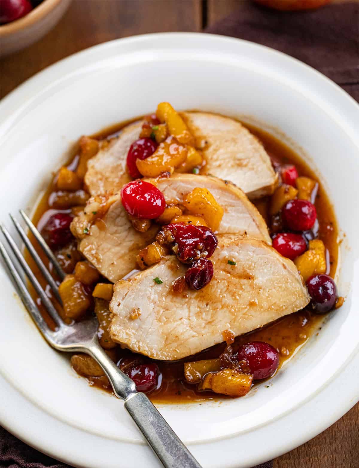 Plate of slices of Cranberry Apple Pork Tenderloin.