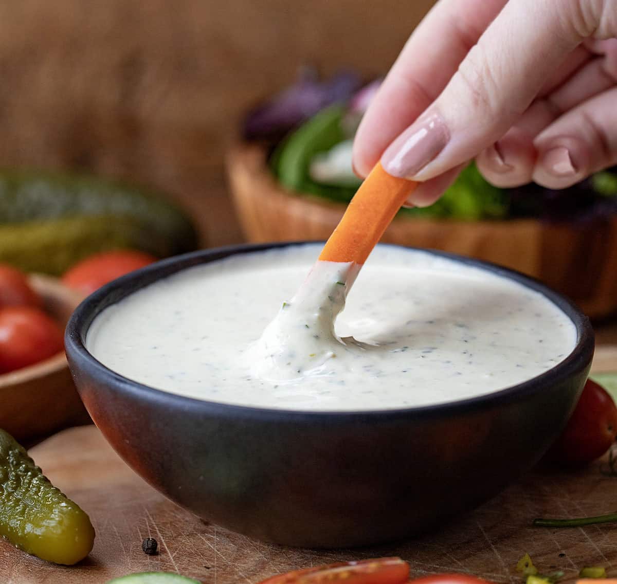 Dipping carrot into Dill Pickle Ranch.