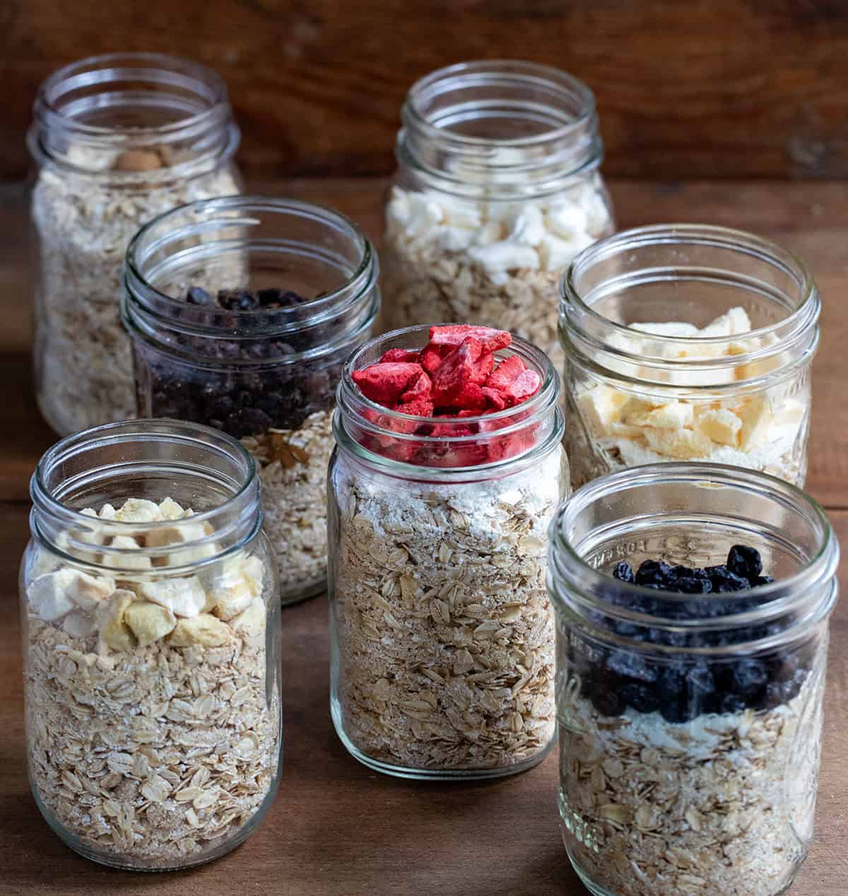 Jars of Homemade Instant Oatmeal on a wooden table.