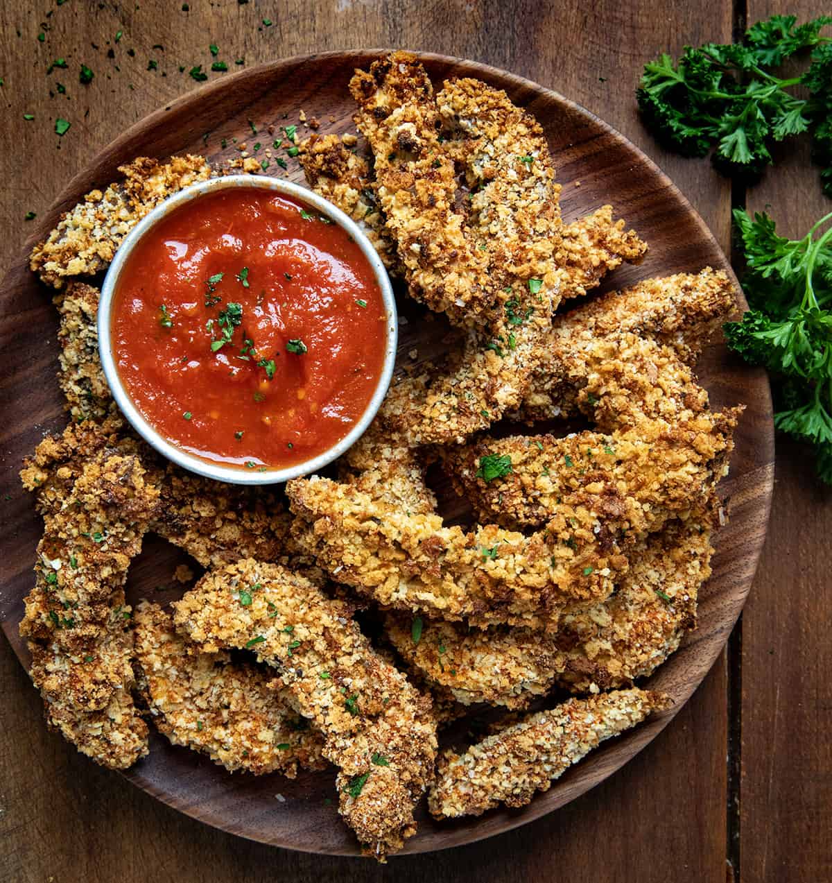 Plate of Portobello Mushroom Fries on a wooden table from overhead.