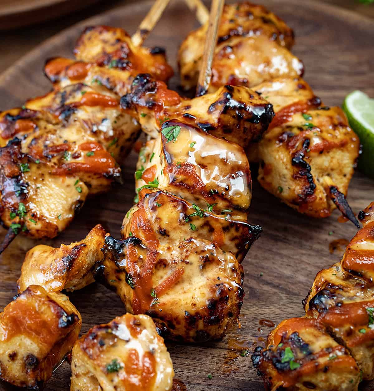 Close up of Chipotle Bang Bang Chicken Skewers on a plate.