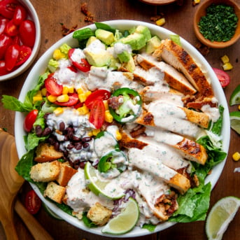 Cowboy Chicken Salad on a wooden table with cowboy ranch dressing from overhead.