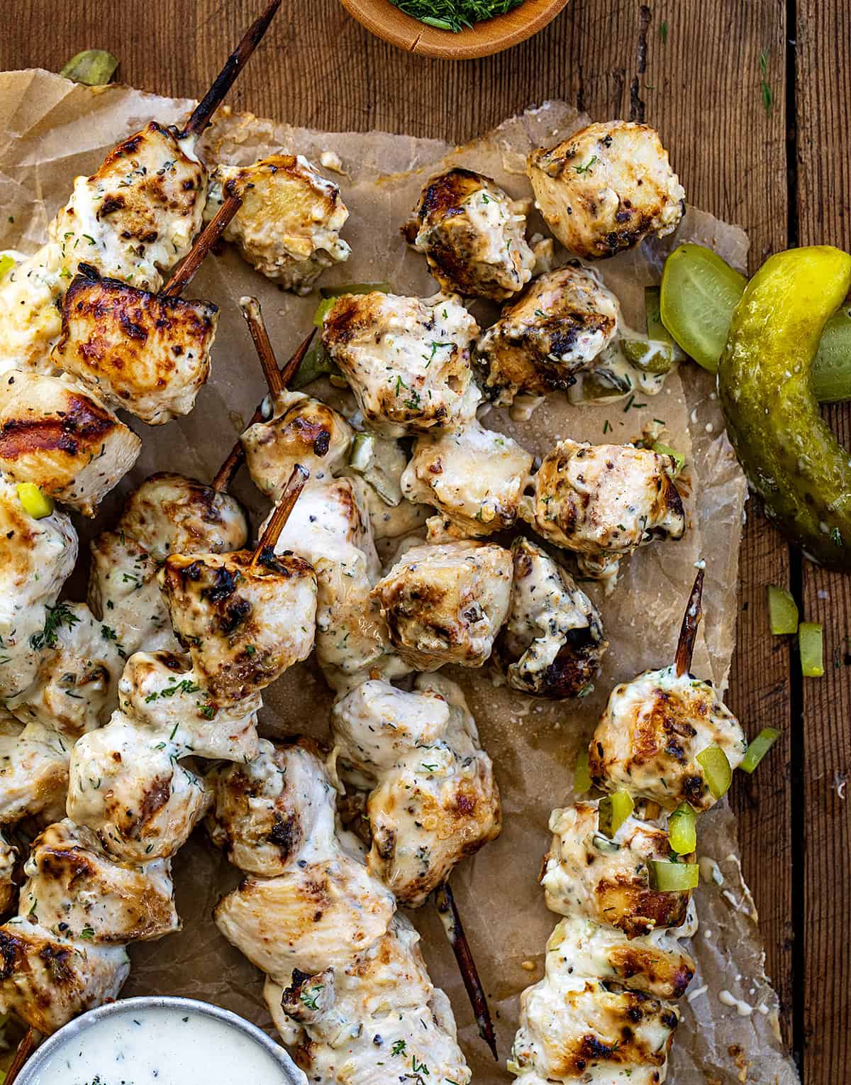 Close up of Dill Pickle Ranch Chicken Skewers with some of the chicken pieces removed from the skewers.