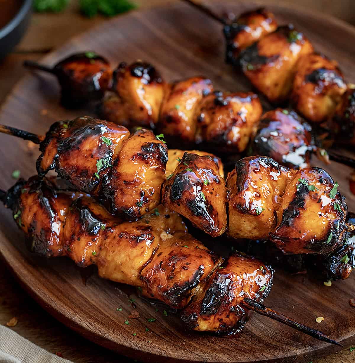 Close up of Firecracker Chicken Skewers on a plate.