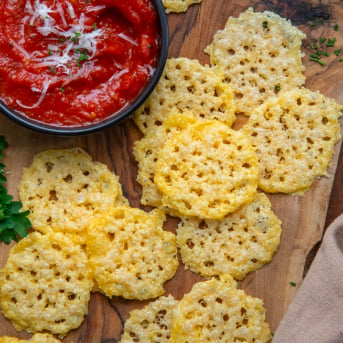 Parmesan Crisps on a cutting board from overhead.