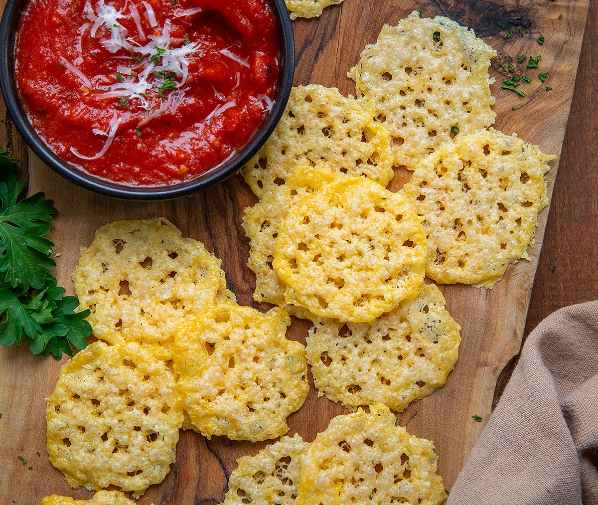 Parmesan Crisps on a cutting board from overhead.