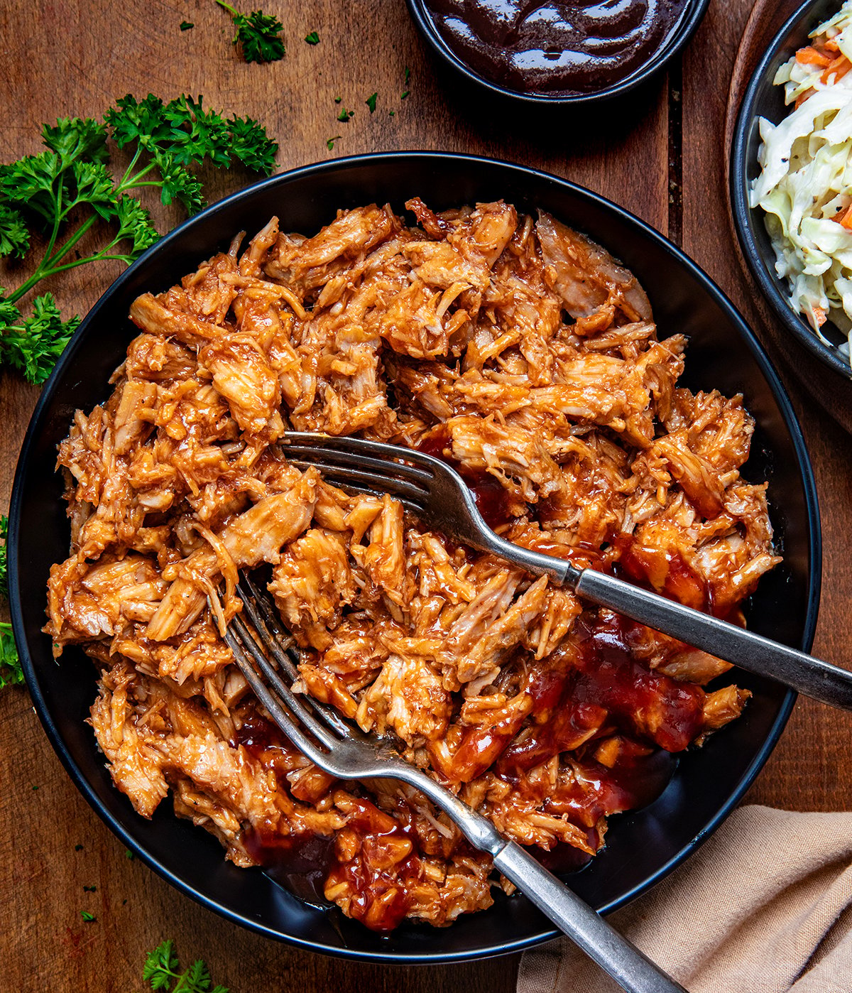 Two Ingredient Pulled Pork in a bowl with two forks in it from overhead.