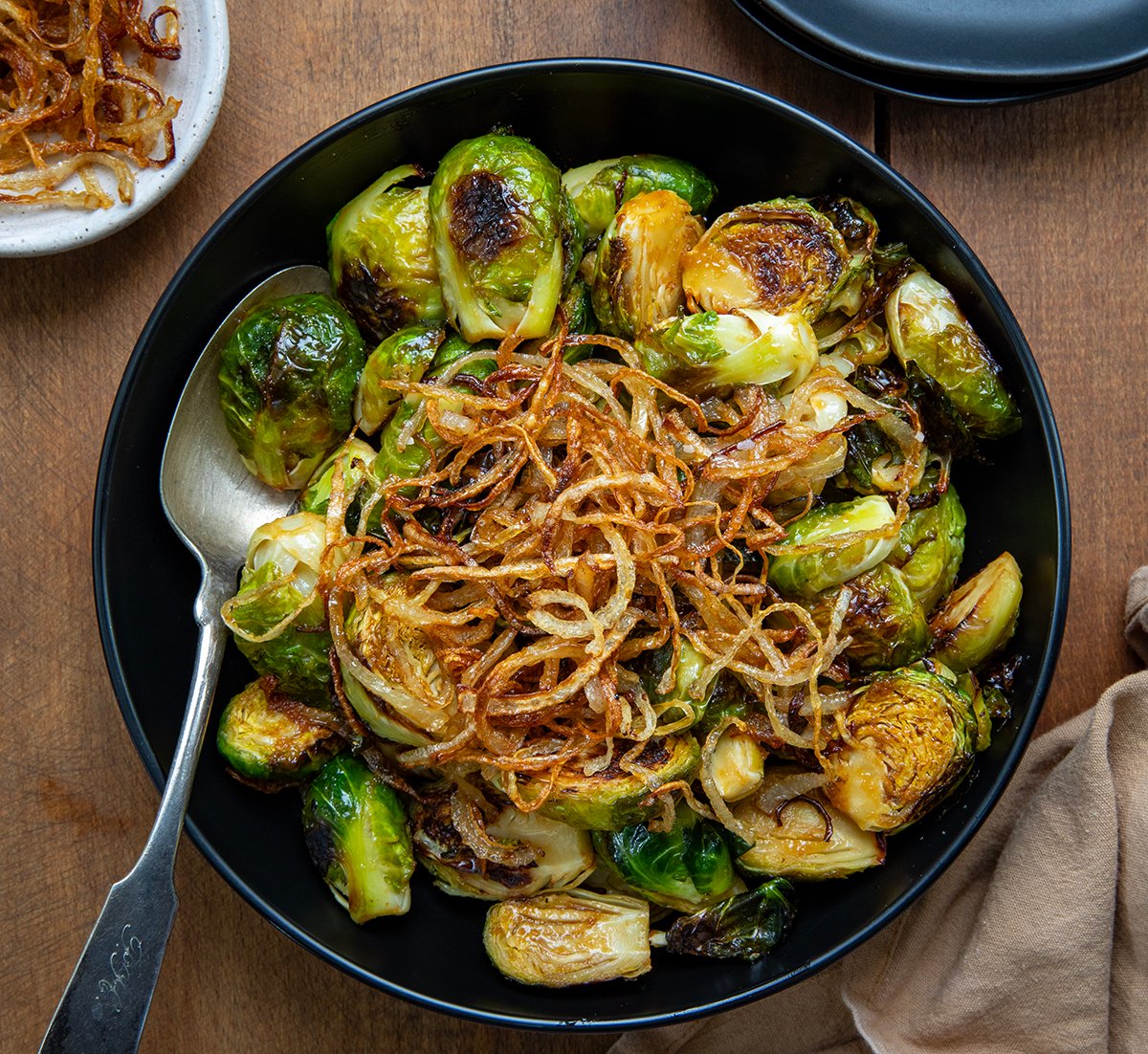 Bowl of Red Lobster Crispy Brussels Sprouts with a spoon in the bowl from overhead.