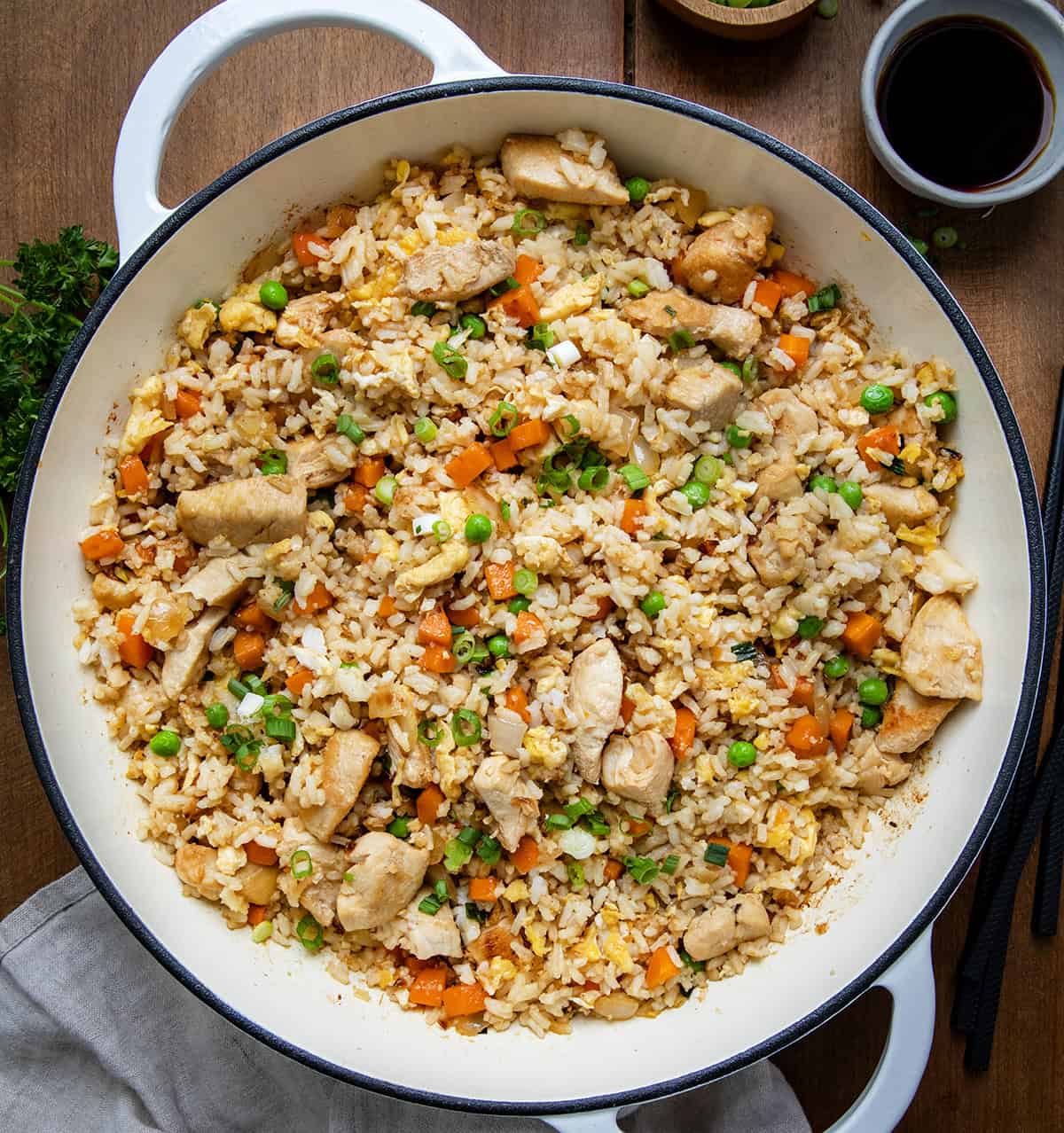 Skillet of Chicken Fried Rice on a wooden table from voerhead. 