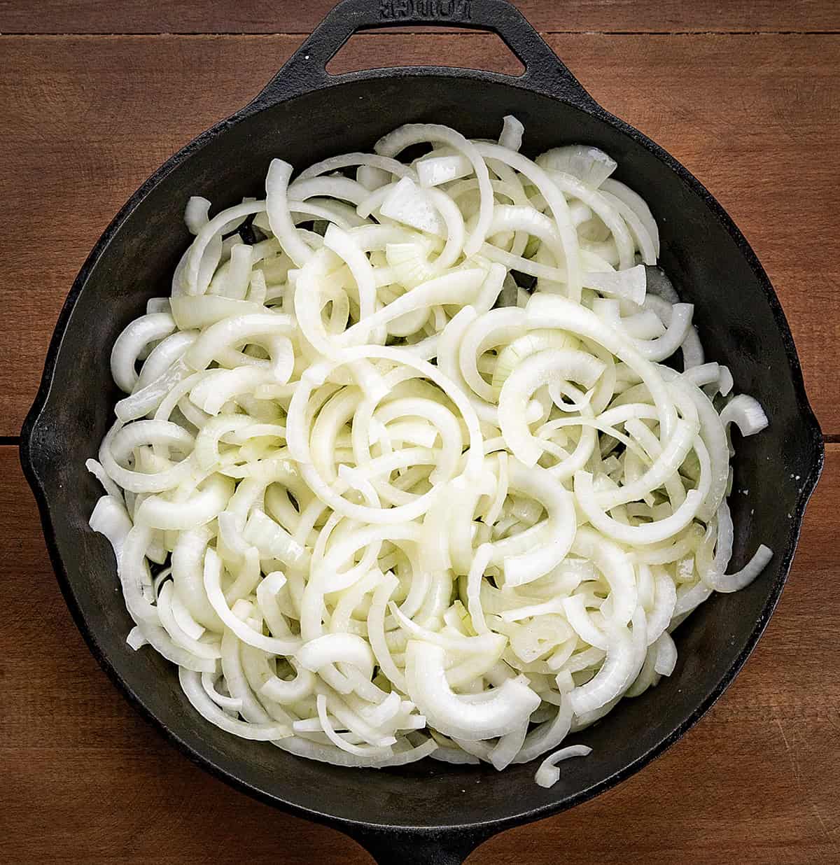 Skillet of raw onions before caramelizing.
