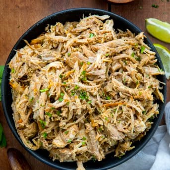 Black bowl filled with Slow Cooker Carnitas.