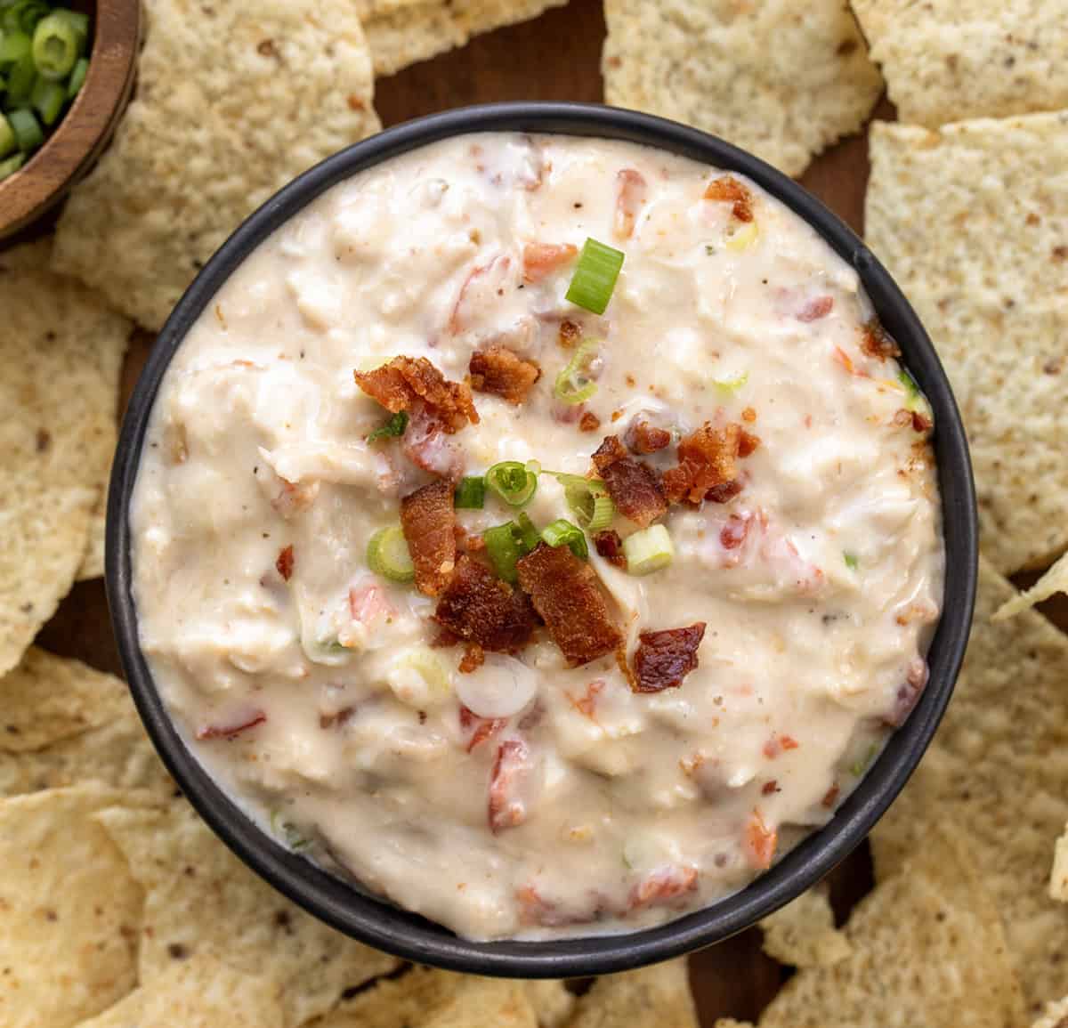 Bowl of Chicken Bacon Ranch Queso surrounded by chips.