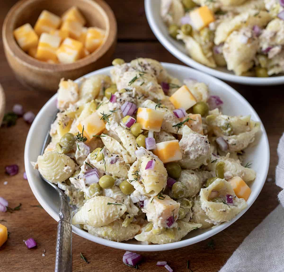 Plate of Tuna Pasta Salad on a wooden table close up.