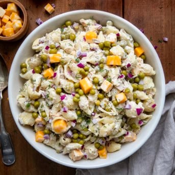 Big what bowl of Tuna Pasta Salad on a wooden table from overhead.