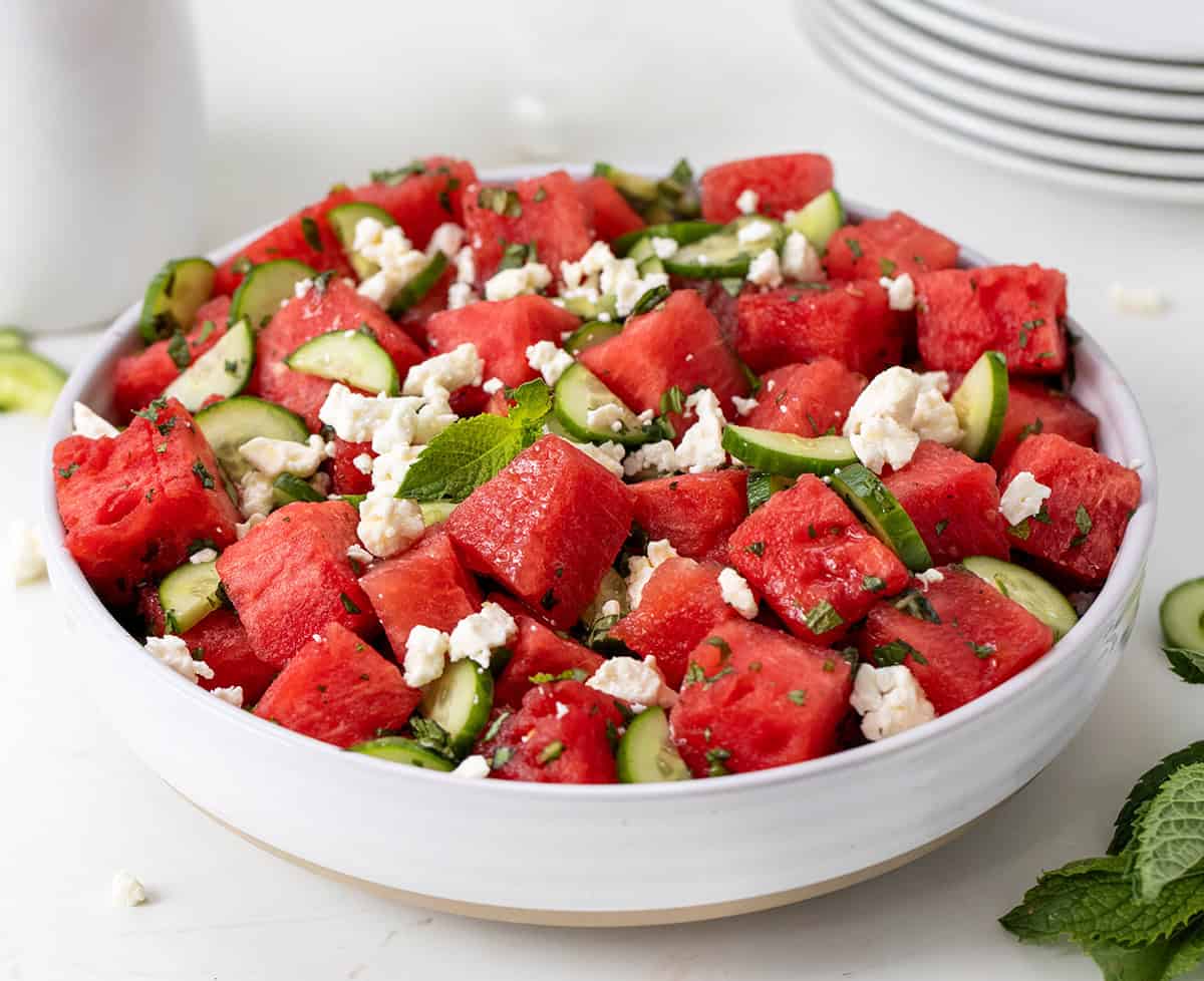 Bowl of Watermelon Feta Salad on a white table close up.