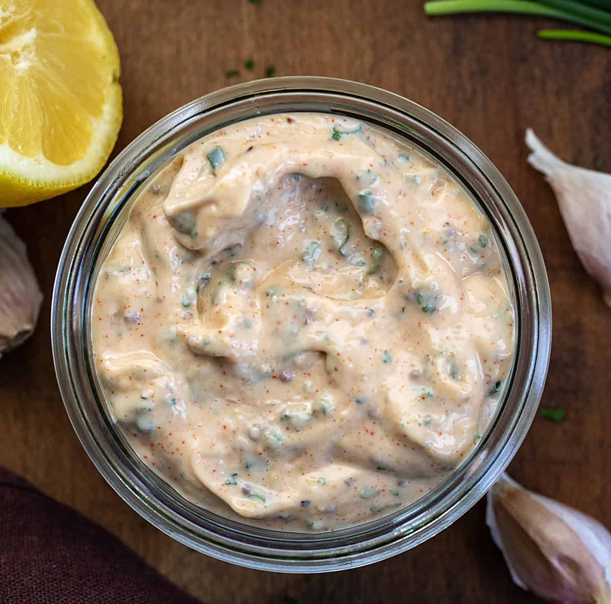 Jar of Cowboy Mayo on a wooden table from overhead.