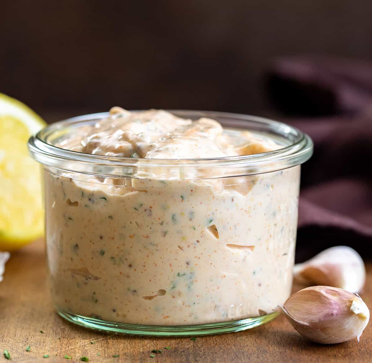 Jar of Cowboy Mayo on a wooden table.