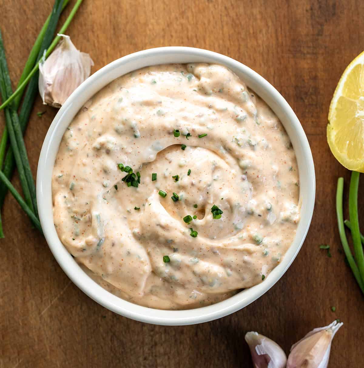 Bowl of Cowboy Mayo on a wooden table from overhead.