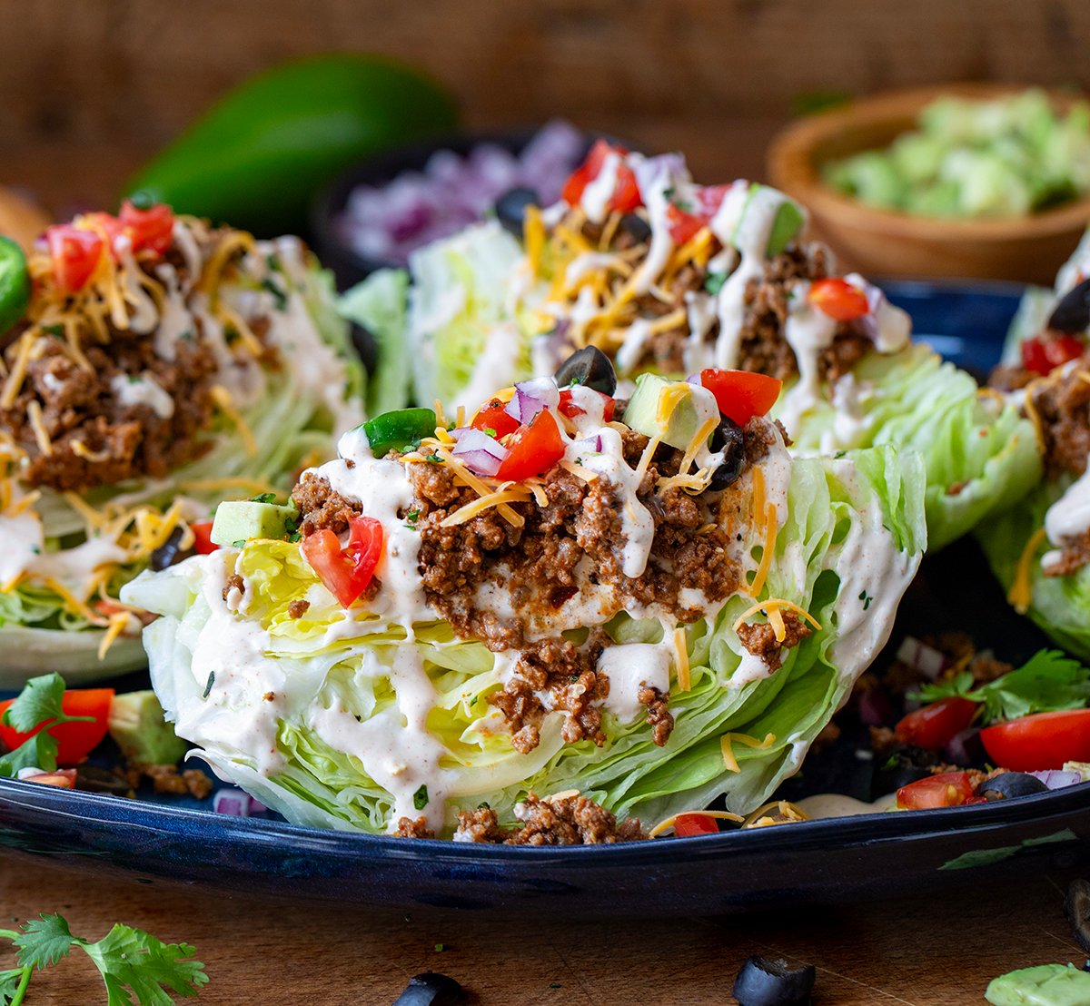 Taco Wedge Salad's on a blue platter close up.
