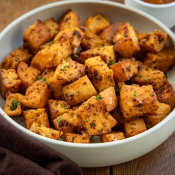 Bowl of Cowboy Croutons on a wooden table.
