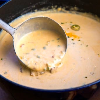 Scooping up Jalapeño Popper Soup from the pot.