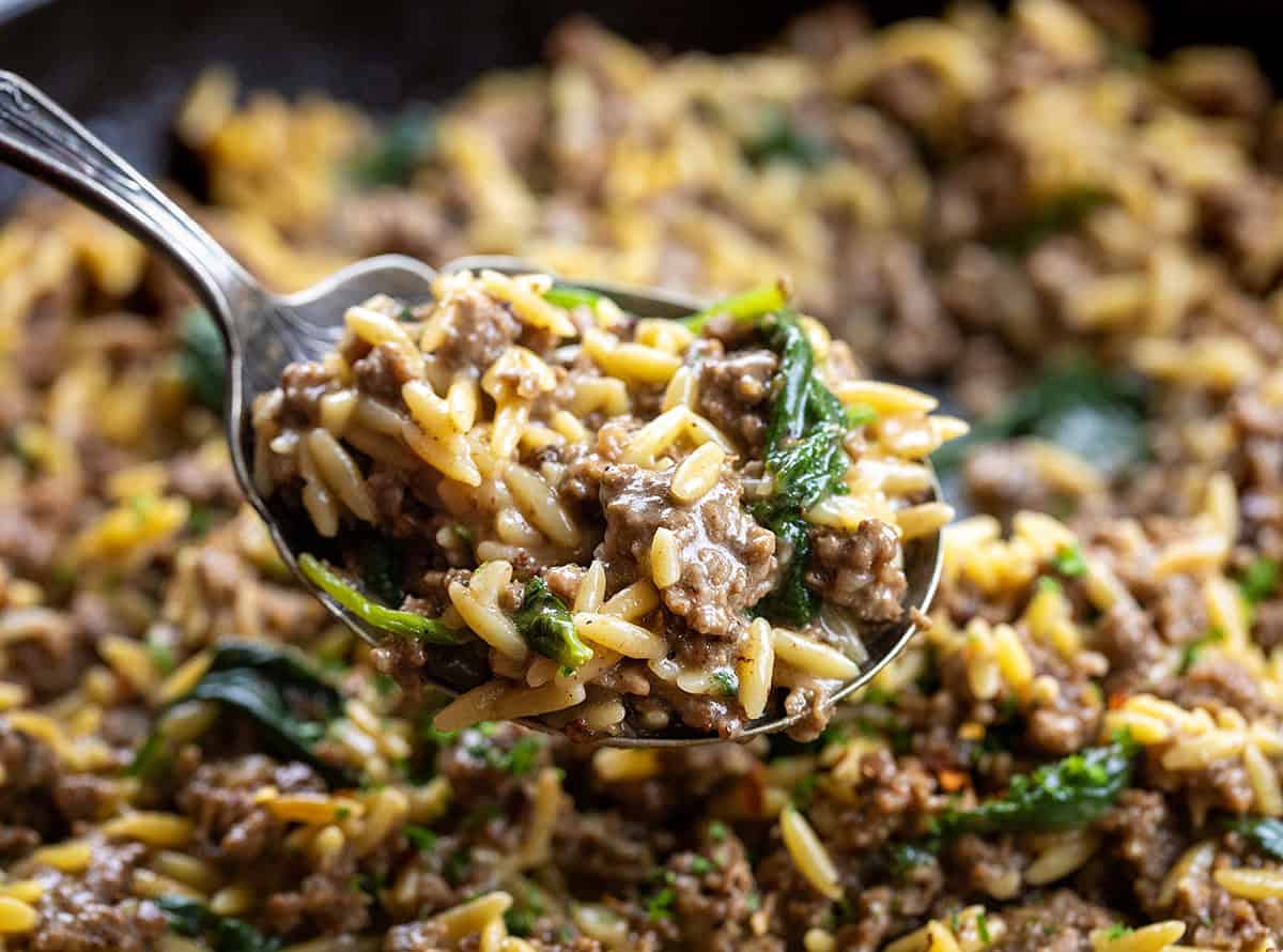 Close up of a spoonful of Cheesy Beef Orzo.