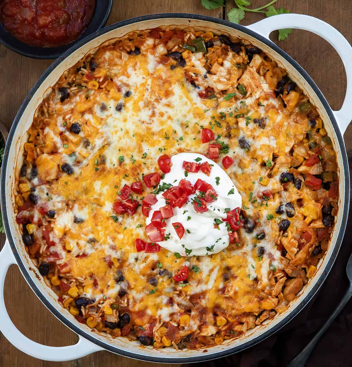 Southwest Chicken Skillet on a wooden table from overhead.
