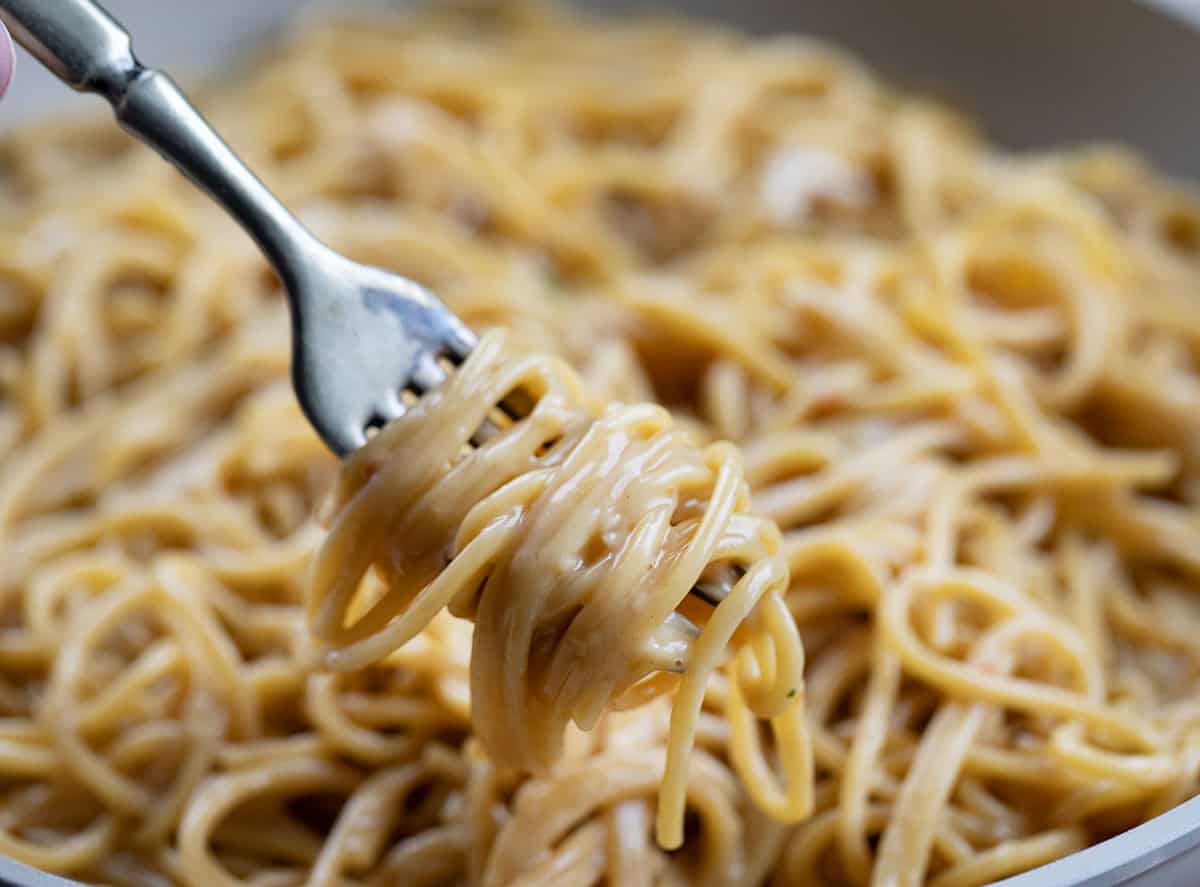 Fork with twirled Sticky Honey Garlic Pasta on it.