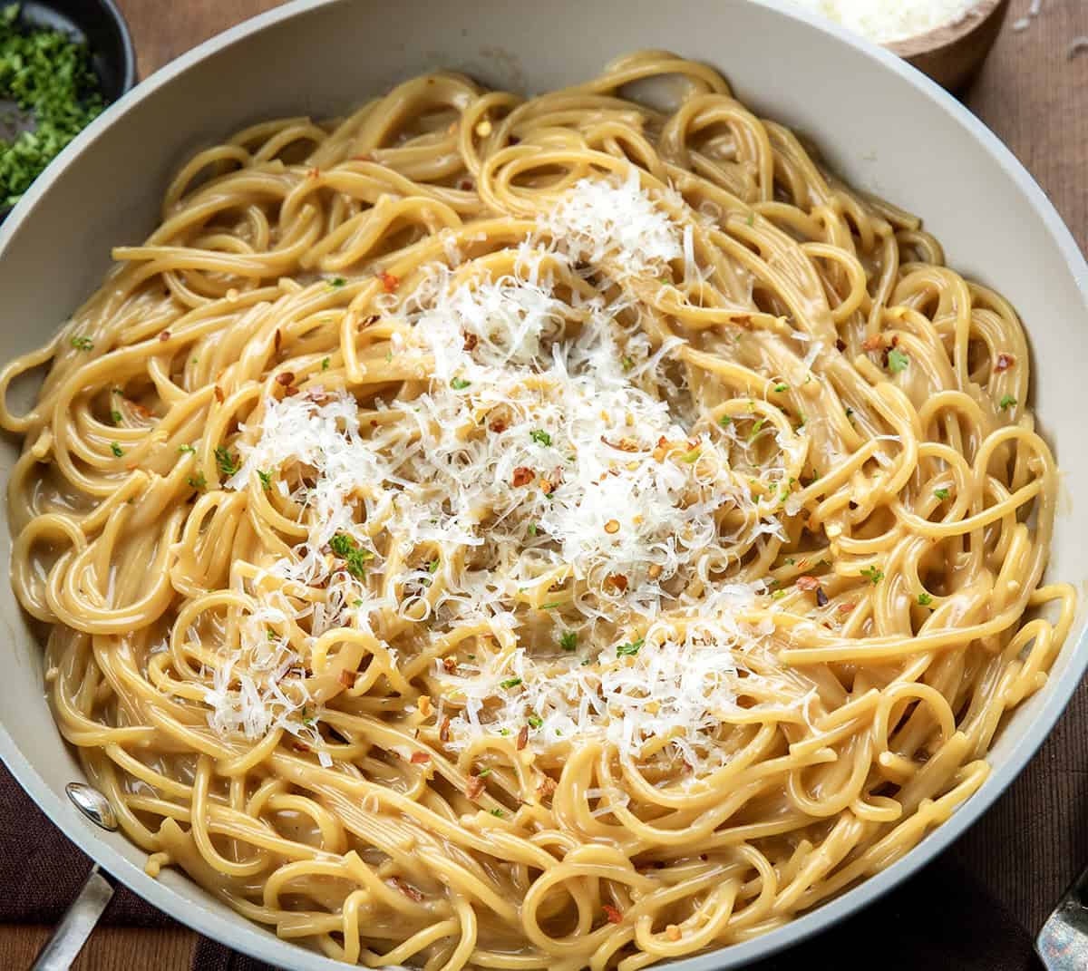 Close up of a skillet of Sticky Honey Garlic Pasta.