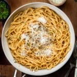 Skillet of Sticky Honey Garlic Pasta on a wooden table from overhead.