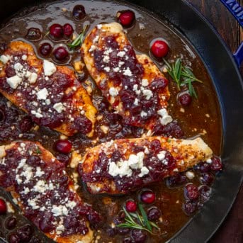 Close up of a skillet of Cranberry Feta Chicken Bake.