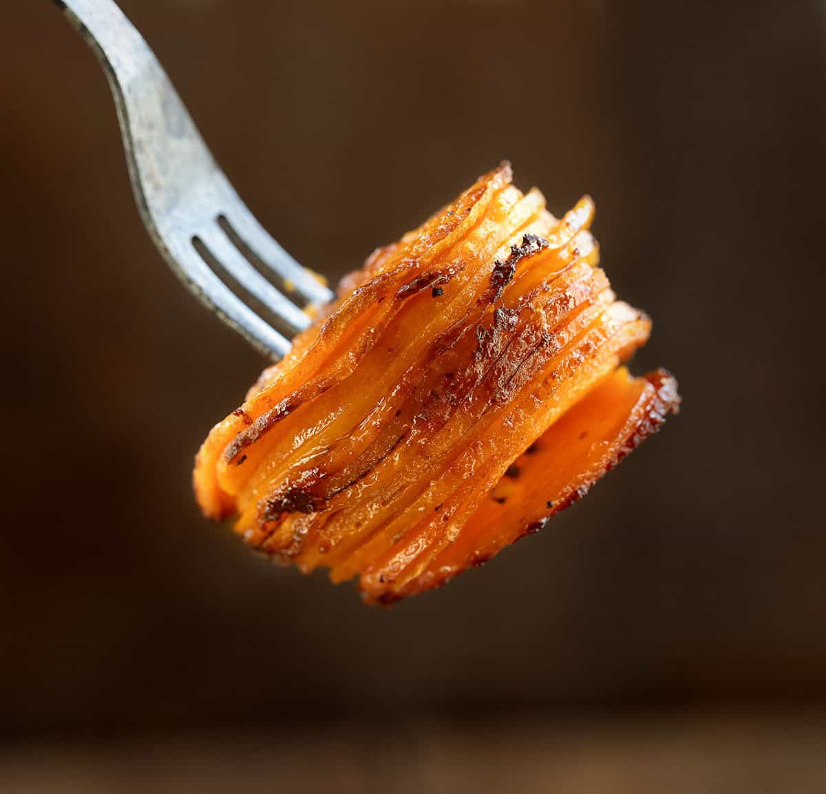 Fork holding a stack of Crispy Sweet Potato.