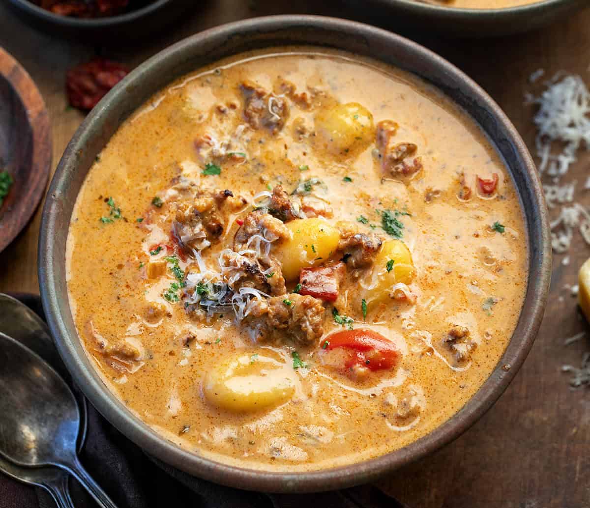 Close up of a bowl of Tuscan Sausage Gnocchi Soup.