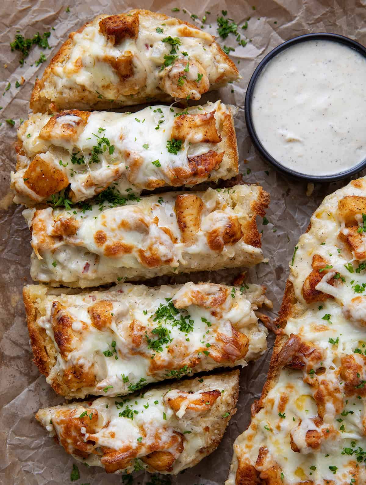This Chicken Alfredo Garlic Bread combines toasted garlic bread with creamy Alfredo sauce and seasoned chicken for an easy, crowd-pleasing meal or appetizer. It’s simple to make, incredibly filling, and always the first thing gone!