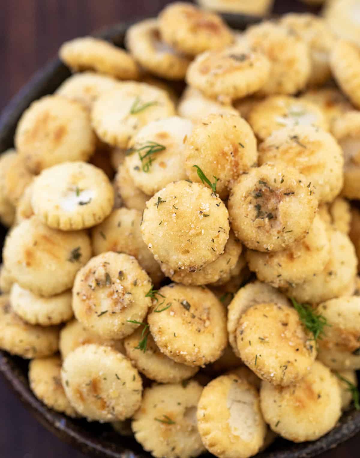 Ranch Oyster Crackers are a simple, savory snack made with pantry staples and baked low and slow for the perfect crunch! Coated in ranch seasoning, garlic, onion, and a hint of dill, these crackers turn golden and crisp as they cool.