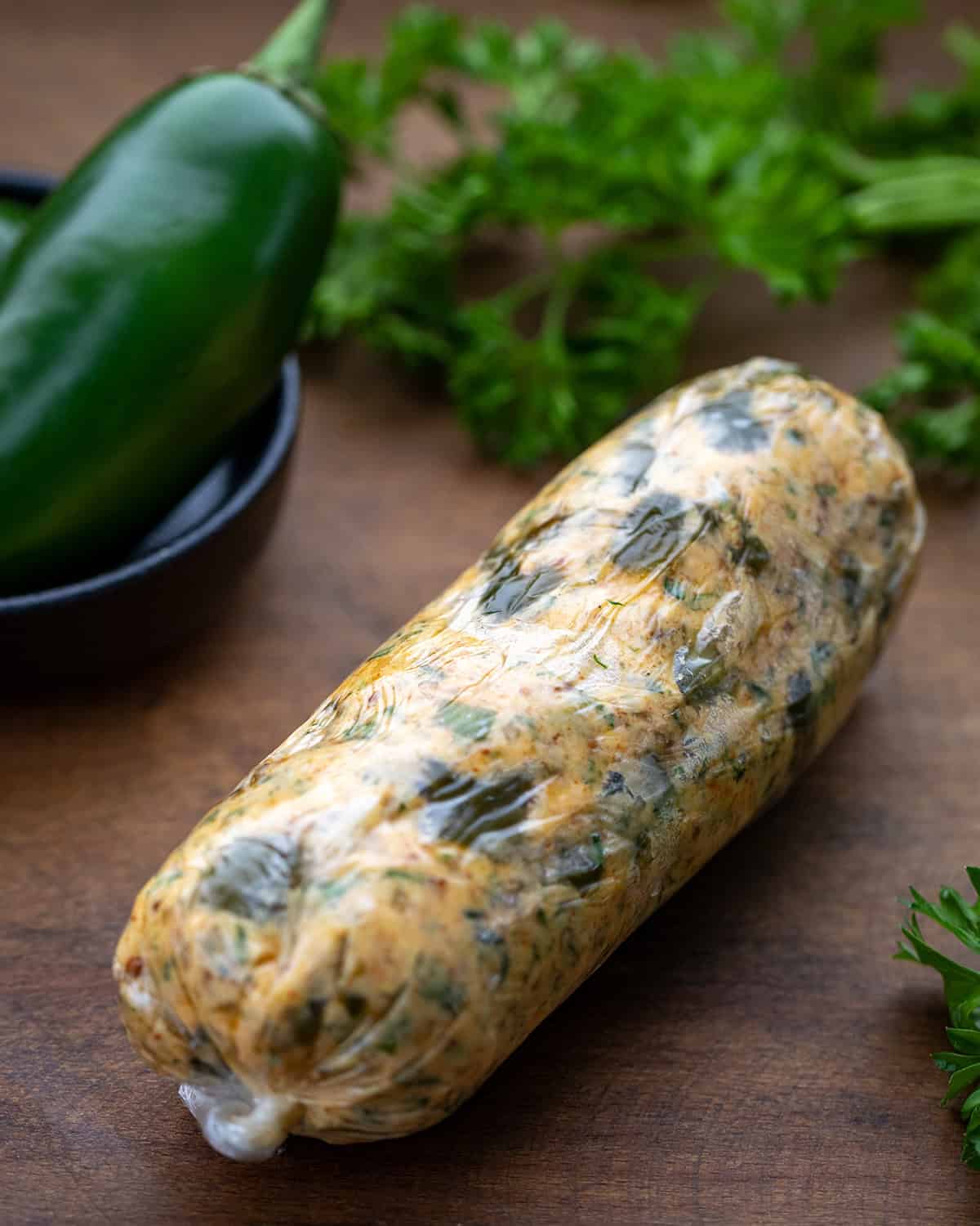 If you love my popular Cowboy Butter, you’re going to love this Roasted Jalapeño Cowboy Butter! Roasting the jalapeños brings out a smoky, slightly sweet flavor and gives the butter a gentle, delicious kick! Plastic wrapped log of Roasted Jalapeño Cowboy Butter.
