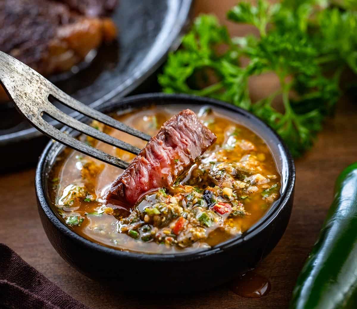 If you love my popular Cowboy Butter, you’re going to love this Roasted Jalapeño Cowboy Butter! Roasting the jalapeños brings out a smoky, slightly sweet flavor and gives the butter a gentle, delicious kick! Dipping steak into Roasted Jalapeño Cowboy Butter.