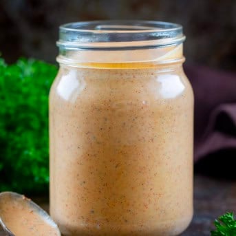 Jar of Southwest Ranch Sauce with a spoon next to it.
