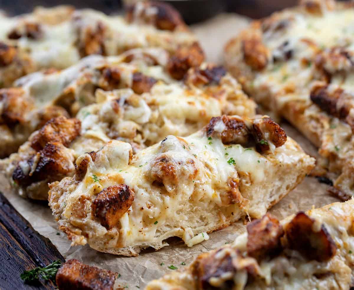 Close up of slices of Blackened Chicken Alfredo Garlic Bread.