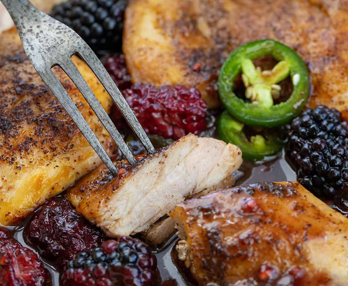 Close up of a piece of Jalapeño Blackberry Chicken that has been cut.