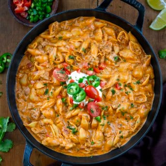 One Pot Taco Pasta on a wooden table from overhead.