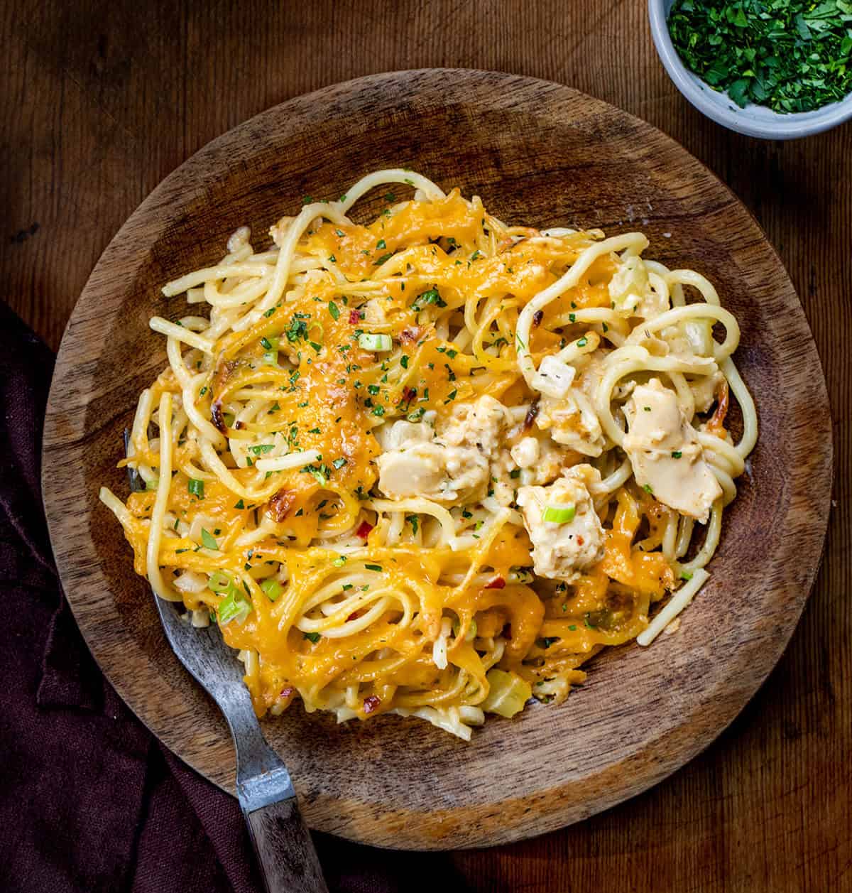 Plate of Cajun Chicken Spaghetti on a wooden table from overhead.