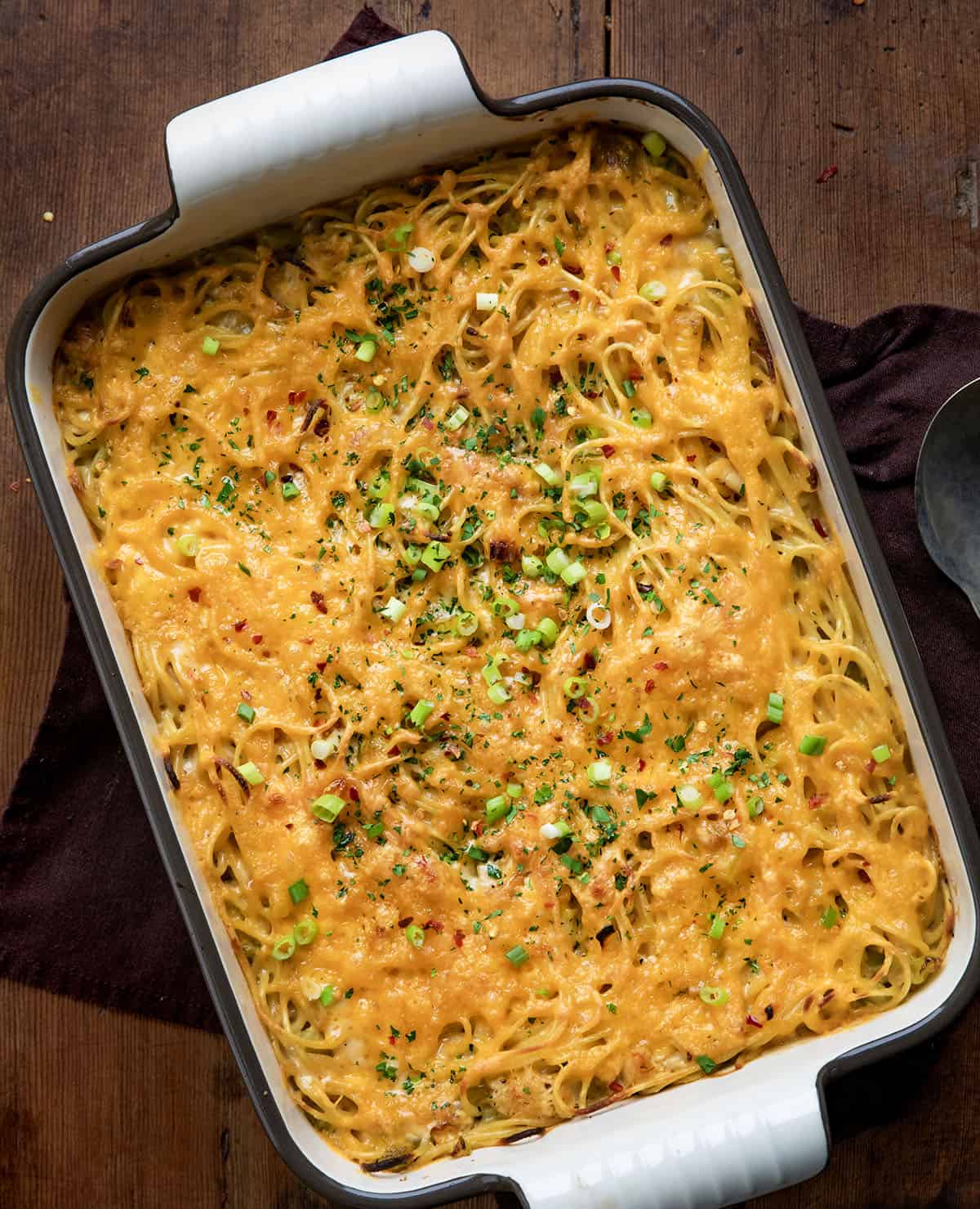 Pan of Cajun Chicken Spaghetti on a wooden table from overhead.