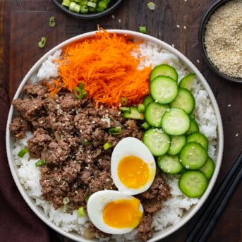 Ground Beef Bulgogi Bowls on a wooden table from overhead.