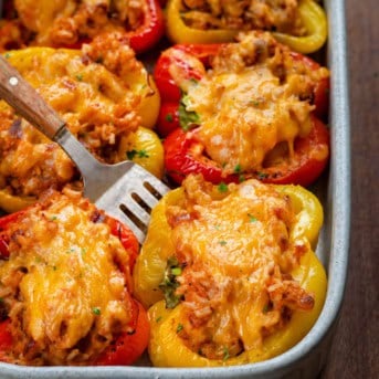 Spatula picking up a Seafood Stuffed Bell Pepper.