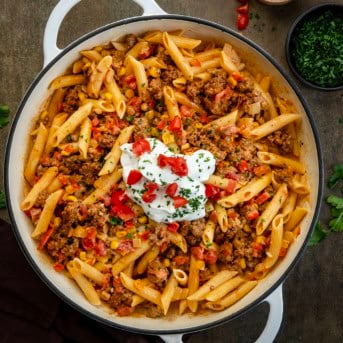 White skillet of Southwest Ground Beef Pasta on a table from overhead.